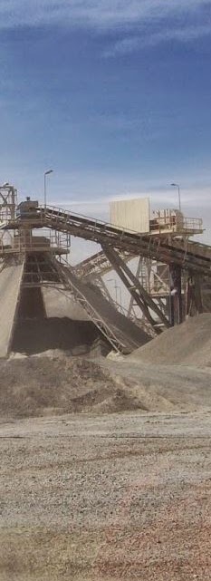 Conveyor and crushed ore stockpile at a mine